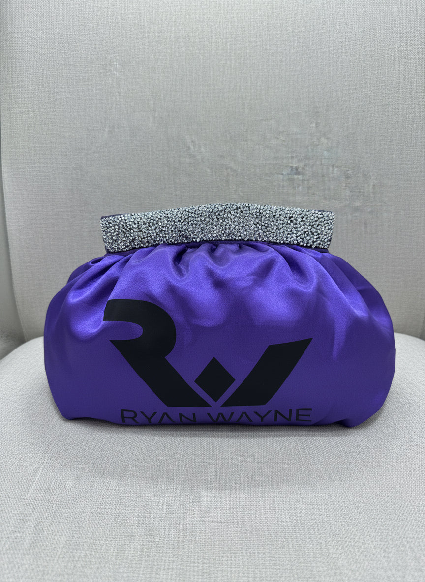 Purple satin headband with 'Ryan Wayne' branding on a gray background