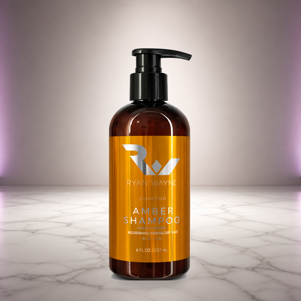 Ryan Wayne Diamond Amber Nourishing Shampoo on white marble with soft plum lighting