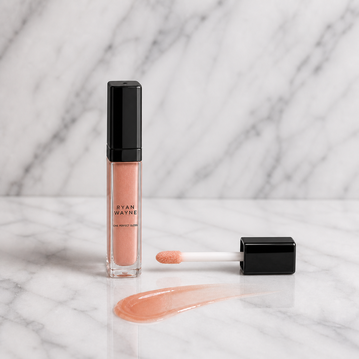 Ryan Wayne One Perfect Gloss slim bottle and straight applicator on white marble