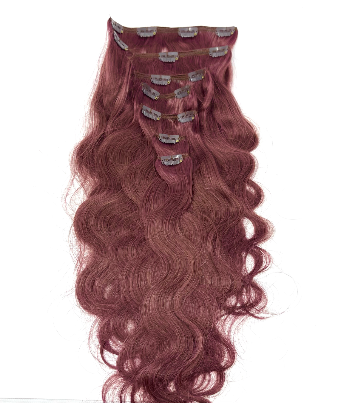 Wavy auburn clip-in extension set with clips visible