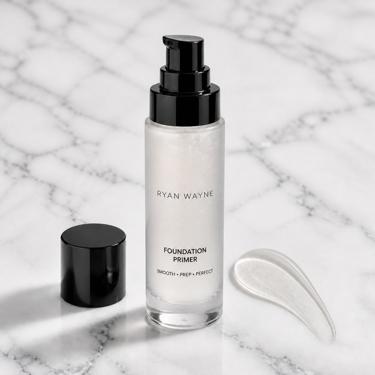 Ryan Wayne Foundation Primer bottle with Ryan Wayne wordmark on white marble